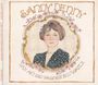 "SANDY DENNY, LIKE AN OLD FASHIONED WALTZ" in geschwungenem Schriftzug, mit einer Illustration einer Frau mit braunen Haaren und Blumen.