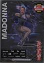 Links steht "MADONNA" vertikal, rechts "Rebel Heart Tour". Farbenfrohe Performanceszene einer Sängerin.