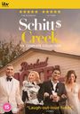 "Schitt$ Creek: The Complete Collection", 5 Sterne Bewertungen, Zitat von Forbes, vier elegant gekleidete Personen vor dem Rosebud Motel.