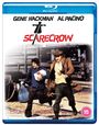 Text: "Gene Hackman Al Pacino" und "Scarecrow" mit einer Vogelscheuche. Zwei Männer laufen neben Eisenbahnschienen.