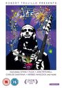 Text: "ROBERT TRUJILLO PRESENTS JACO", mit Künstlernamen, darunter ein Porträt eines Musikers mit einer Gitarre in bunten Farben.
