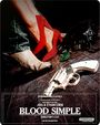 Text: "Blood Simple, Director's Cut, Joel & Ethan Coen." 
Motiv: Rote Schuhe, Cowboy-Stiefel, Revolver auf Holzboden.