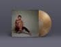"GRETCHEN PARLATO THE WISE ONES" in Goldschrift. Eine Frau in flauschiger Jacke posiert. Eine goldene Vinyl-Schallplatte.