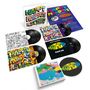 "Happy Mondays" Alben und EPs mit bunten Covern und Schallplatten in einem Set arrangiert.