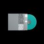 Texte: THE DURUTTI COLUMN RENASCENT. Eine graue Plattenhülle mit türkisfarbener Vinyl-Schallplatte rechts daneben.
