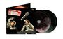 Text: "SPARKS LIVE ON THE MOON", "FRIDAY 8PM". Illustration: Zwei Astronauten im Weltall mit einem Mikrofon, CDs mit Mondmotiv.