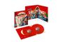 Text: "MADNESS HIT PARADE VOLUME ONE 1979–1986" und "SHOWTIME!". Rotes, fröhliches Vinyl-Set mit Musiker-Illustrationen.