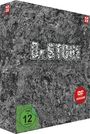 "Dr. STONE" in großen, steinartigen Buchstaben. Grünes FSK 12-Siegel, rotes "DVD VIDEO VERSION"-Logo links oben.