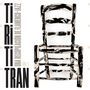 "Ti Ri Ti Tran. Una recopilación de Flamenco-Jazz Vol. 1" steht links. Rechts ein abstrakt bemalter Stuhl.