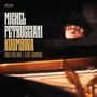 Text: Michel Petrucciani, Kuumbwa, Dave Holland, Eliot Zigmund.  
Ein Musiker mit Brille und Hut am Flügel.