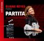 Text: "Eliane Reyes Piano Partita Music from the Movies". Frau in einem stilvollen Kleid lächelt, roter Kinosaal im Hintergrund.