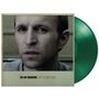 "JAY-JAY JOHANSON BEST OF 1996–2026." Nahes Porträt eines nachdenklichen Mannes und eine grüne Schallplatte.