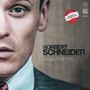 „NORBERT SCHNEIDER“, „neuaufnahme“. Hälfte eines Gesichts in einem Anzug, Kreis mit Inschrift oben rechts.