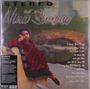 "Stereo Nina Simone". Lieder: "I Loves You Porgy", "Mood Indigo". Sie sitzt auf einer Parkbank, in ein rotes Tuch gekleidet.