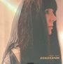 Texte: "JACQUI HUNT DESIDERIUM". Frau im Profil, dunkles Haar, trägt Schleier, sanftes Licht.
