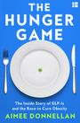 „THE HUNGER GAME“ steht oben. Darunter ein Teller mit einer Erbse, daneben Messer und Gabel. Unten: „Aimee Donnellan“.