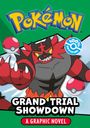 "Pokémon", "Grand Trial Showdown", "A Graphic Novel". Illustration eines roten, katzenähnlichen Wesens mit Pokébällen.