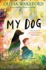 "MY DOG. The story of an extraordinary friendship." Ein Junge und ein Hund sitzen auf einer Blumenwiese, umgeben von Natur.