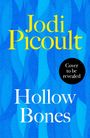 "Jodi Picoult", "Hollow Bones", "Final Cover to be Revealed". Frau mit lockigem Haar vor unscharfem Hintergrund.