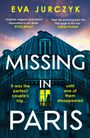 Oben steht "Eva Jurczyk". Der Titel lautet "Missing in Paris". Ein Haus mit erleuchtetem Fenster.