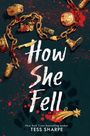 "How She Fell" in weißer Schrift. Umgeben von einer goldenen Kette mit Anhängern auf blutbespritztem Hintergrund.