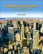 Text: "URBAN GEOGRAPHY: SOCIAL AND SPATIAL DYNAMICS OF THE CITY, Barney Warf". Hohe Gebäude in einer Stadtansicht.
