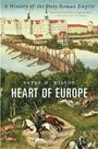 Text: "A History of the Holy Roman Empire", "Peter H. Wilson", "Heart of Europe". Illustration: Mittelalterliche Szene mit Burg und Brücke.