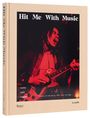 "Hit Me With Music". "roots rock reggae". Musiker spielt Gitarre leidenschaftlich, rote Beleuchtung. Lee Jaffe.