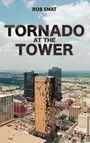 „TORNADO AT THE TOWER“ steht in großen Buchstaben vor einer Stadtsilhouette mit Hochhäusern und bewölktem Himmel.
