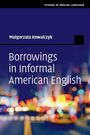 "Borrowings in Informal American English" von Małgorzata Kowalczyk. Verschwommene Stadtlichter im Hintergrund.