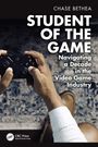 „Student of the Game: Navigating a Decade in the Video Game Industry“ von Chase Bethea, zwei Hände mit Controller.