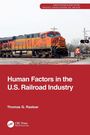 "Human Factors in the U.S. Railroad Industry" von Thomas G. Raslear. Ein Zug und ein Bahnarbeiter mit Warnweste sind sichtbar.