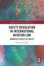 "Safety Regulation in International Aviation Law" von Grzegorz K. Zając. Farbige abstrakte Muster, Logo unten rechts.
