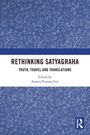 "Buch mit blauem Hintergrund und weißen Blumen; Titel: Rethinking Satyagraha. Herausgeber: Ananta Kumar Giri."
