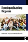 Exploring and Attaining Happiness. Eine Gruppe lachender Menschen sitzt auf einer Wiese.