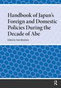 „Handbook of Japan's Foreign and Domestic Policies During the Decade of Abe“, edited by Tosh Minohara. Hintergrund mit blauen Wabenmuster.