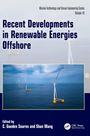 "Recent Developments in Renewable Energies Offshore" auf blauem Hintergrund. Ein Windpark auf dem Meer.