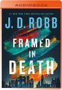 "AUDIOBOOK", "*NEW YORK TIMES BESTSELLING AUTHOR*", "J. D. ROBB", "FRAMED IN DEATH". Farbige Pinselstriche, Skyline unten.