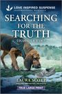 „LOVE INSPIRED SUSPENSE. SEARCHING FOR THE TRUTH. COLORADO K-9 UNIT. LAURA SCOTT.“ Ein Hund schnüffelt an einem Schuh.