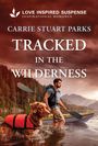 Text: "Love Inspired Suspense, Inspirational Romance, Carrie Stuart Parks, Tracked in the Wilderness." Mann mit Hund am See, Berge.