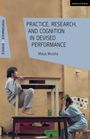 Texte: "Practice, Research, and Cognition in Devised Performance" von Maiya Murphy. Zwei Personen in Pyjamas agieren mit Tischen.