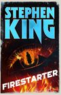 Text: "Stephen King" in großen blauen Buchstaben, "Firestarter" diagonal in weiß. Silhouette in flammendem Auge.