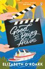 Text: „Good at Being Alive“, „Smart, sharp, sizzling“, Elsie Silver, Elizabeth O'Roark. Eine Klappe über Wasser mit Boot.