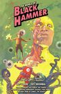 "The World of Black Hammer". Buntes Comic-Cover mit Figuren, Tentakeln, schwebendem Kind, Tentakeln und abstraktem Hintergrund.
