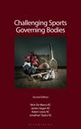 "Challenging Sports Governing Bodies. Second Edition. Verschiedene Sportutensilien wie Boxhandschuhe und Basketball."