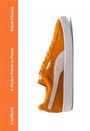 Text: "Adam Cheung", "A Pocket Guide to Puma", "Unofficial". Abgebildet ist ein orangefarbener Puma-Sneaker seitlich.