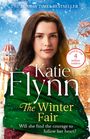 "The Sunday Times Bestseller", "Katie Flynn", "The Winter Fair", "Loved by over 4 million readers", Frau im Schnee, Jahrmarkt-Hintergrund.