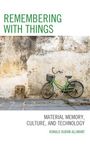 „Remembering with Things: Material Memory, Culture, and Technology“ von Ronald Durán Allimant, grünes Fahrrad an alter Wand.