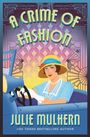 Text: "A Crime of Fashion" und "Julie Mulhern, USA Today Bestselling Author". 

Illustration einer eleganten Frau im Auto.