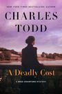Text: „NEW YORK TIMES BESTSELLING AUTHOR CHARLES TODD A Deadly Cost A Bess Crawford Mystery“. Frau blickt auf See.